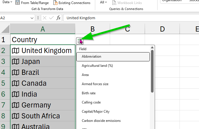 Arrow pointing to the insert data button in Excel.